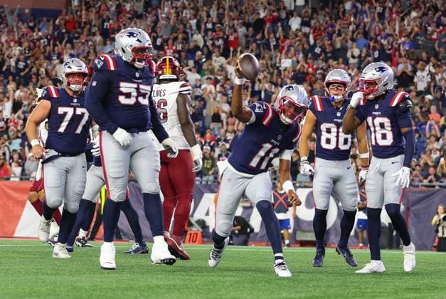FOXBOROUGH, MA - AUGUST 08: New England Patriots quarterback Joshua Dobbs (11) spikes the ball after a touchdown during the NFL, American Football Herren, USA preseason game between Washington Commanders and New England Patriots on August 8, 2025, at Gillette Stadium in Foxborough, MA. (Photo by M. Anthony Nesmith Icon Sportswire) NFL: AUG 08 Preseason Commanders at Patriots EDITORIAL USE ONLY Icon25080843
