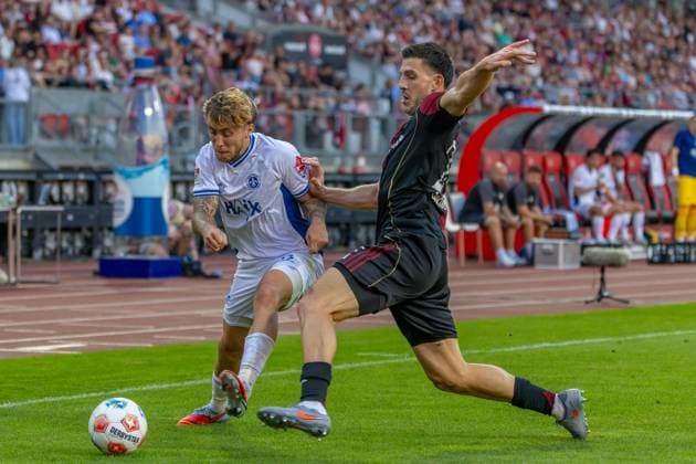 Nürnberg, Deutschland 08. August 2025: 2. Liga - 2025 2026 - 1. FC Nürnberg vs. SV Darmstadt 98 Im Bild: v. li. im Zweikampf Luca Marseiler (Darmstadt) und Luka Lochoshvili (FCN) DFL regulations prohibit any use of photographs as image sequences and or quasi-video