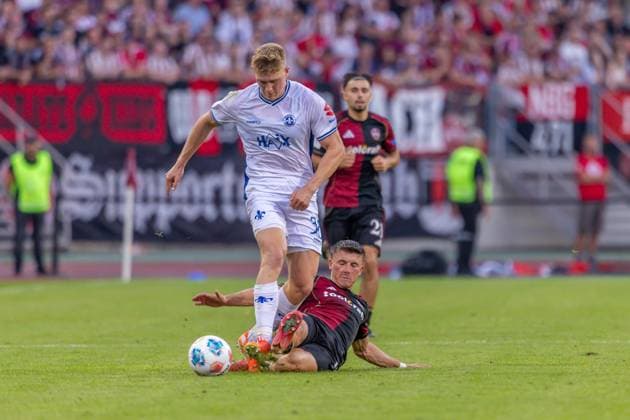 Nürnberg, Deutschland 08. August 2025: 2. Liga - 2025 2026 - 1. FC Nürnberg vs. SV Darmstadt 98 Im Bild: v. li. im Zweikampf Clemens Riedel (Darmstadt) und Semir Telalovic (FCN) DFL regulations prohibit any use of photographs as image sequences and or quasi-video