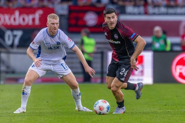 Nürnberg, Deutschland 08. August 2025: 2. Liga - 2025 2026 - 1. FC Nürnberg vs. SV Darmstadt 98 Im Bild: v. li. im Zweikampf Kai Klefisch (Darmstadt) und Luka Lochoshvili (FCN) DFL regulations prohibit any use of photographs as image sequences and or quasi-video