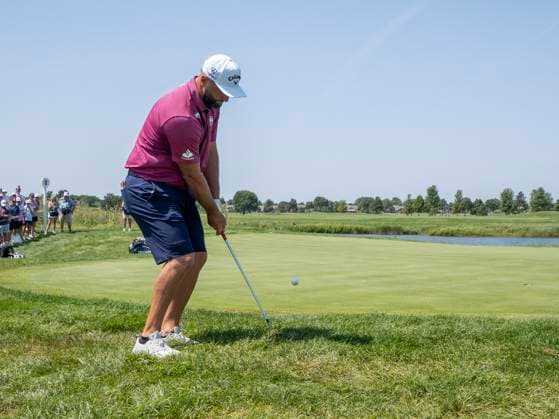 BOLINGBROOK, IL - AUGUST 09: Jon Rahm chips the ball out of the rough onto the second green during day two of LIV Golf Chicago on Saturday, August 09, 2025 at Bolingbrook Golf Club in Bolingbrook, IL. (Photo by Joseph Weiser Icon Sportswire) GOLF: AUG 09 LIV Golf Chicago EDITORIAL USE ONLY Icon250809017