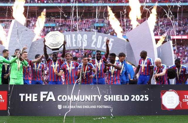 London, England, 10th August 2025. Marc GuÃ hi of Crystal Palace lifts the trophy and celebrates with team mates after the Crystal Palace vs Liverpool FA Community Shield match at Selhurst Park, London. Picture credit should read: Paul Terry Sportimage EDITORIAL USE ONLY. No use with unauthorised audio, video, data, fixture lists, club league logos or live services. Online in-match use limited to 120 images, no video emulation. No use in betting, games or single club league player publications. SPI_058_PT_Crystal_Palace_Liverpool SPI-4057-0058