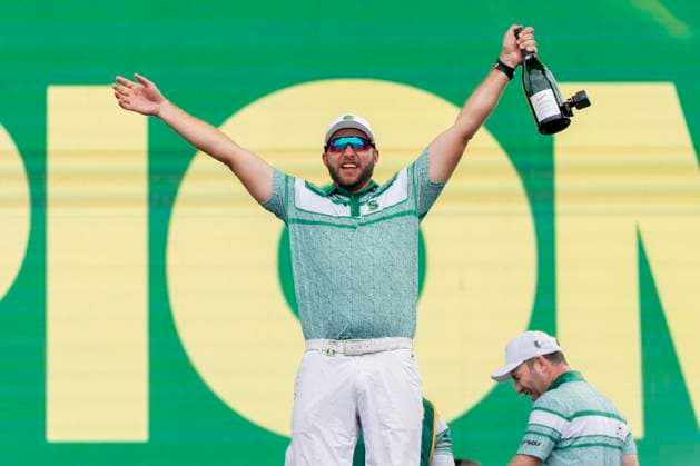 BOLINGBROOK, IL - AUGUST 10: Dean Burmester celebrates winning the LIV Golf Chicago team championship while holding a bottle of champagne after the final round of LIV Golf Chicago on Sunday, August 10, 2025 at Bolingbrook Golf Club in Bolingbrook, IL (Photo by Ben Hsu Icon Sportswire) GOLF: AUG 10 LIV Golf Chicago EDITORIAL USE ONLY Icon224250810077
