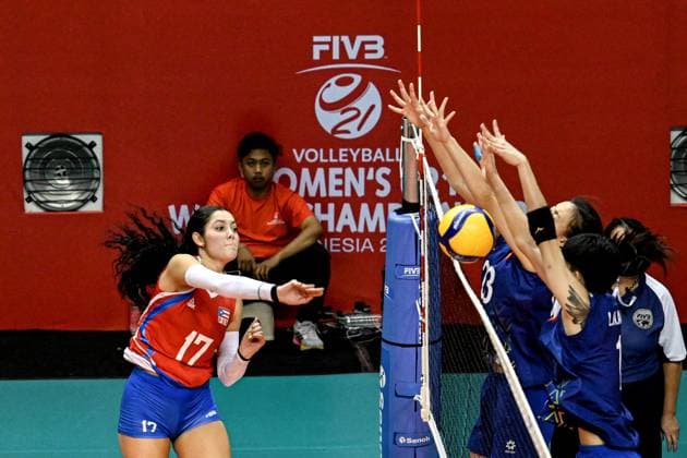 (250812) -- SURABAYA, Aug. 12, 2025 -- Josdarilee Caraballo Medina (L) of Puerto Rico spikes the ball during the women s preliminary phase Pool A match between Vietnam and Puerto Rico at the Volleyball Women s U21, U 21 World Championship, WM, Weltmeisterschaft in Surabaya, East Java province, Indonesia, on Aug. 12, 2025. ) (SP)INDONESIA-SURABAYA-VOLLEYBALL-WOMEN S-U21-WORLD CHAMPIONSHIP-PRELIMINARY PHASE-VIETNAM VS PUERTO RICO AgungxKuncahyaxB. 