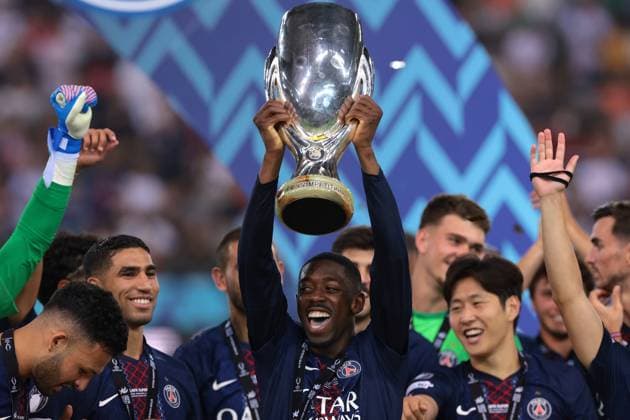 Udine, Italy, 13th August 2025. Ousmane Dembele of PSG lifts the trophy as he celebrates with team mates following the penalty shoot out victory in the Paris Saint Germain vs Tottenham Hotspur UEFA Super Cup match at Stadio Friuli, Udine. Picture credit should read: Jonathan Moscrop Sportimage EDITORIAL USE ONLY. No use with unauthorised audio, video, data, fixture lists, club league logos or live services. Online in-match use limited to 120 images, no video emulation. No use in betting, games or single club league player publications. SPI_067_JM_PSG_TOTTENHAM_ SPI-4061-0067