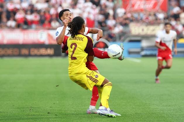 UTRECHT , 14-08-2025 , stadium Galgenwaard , season 2025 2026 , UEFA Europa League football , Third qualifying round 2nd leg , match between FC Utrecht and Servette , picture shows FC Utrecht player Adrian Blake, Servette player Loun Srdanovic Utrecht - Servette  x30499678x Copyright: