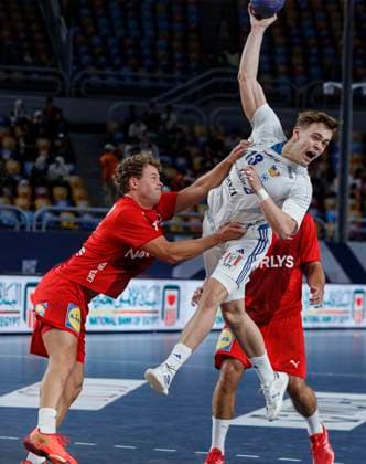 (250815) -- CAIRO, Aug. 15, 2025 -- Dagur Arni Heimisson (top) of Iceland shoots during the quarterfinal handball match between Denmark and Iceland at the 11th IHF Men s Youth World Championship, WM, Weltmeisterschaft 2025 in Cairo, Egypt, on Aug. 14, 2025. ) (SP)EGYPT-CAIRO-HANDBALL-MEN S YOUTH WORLD CHAMPIONSHIP-QUARTERFINAL-DENMARK VS ICELAND AhmedxGomaa 