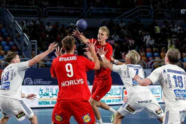 (250815) -- CAIRO, Aug. 15, 2025 -- Emil Hansen (top) of Denmark shoots during the quarterfinal handball match between Denmark and Iceland at the 11th IHF Men s Youth World Championship, WM, Weltmeisterschaft 2025 in Cairo, Egypt, on Aug. 14, 2025. ) (SP)EGYPT-CAIRO-HANDBALL-MEN S YOUTH WORLD CHAMPIONSHIP-QUARTERFINAL-DENMARK VS ICELAND AhmedxGomaa 