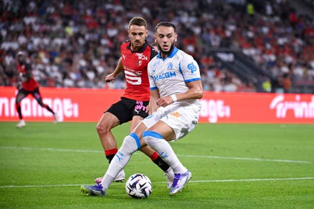FOOTBALL : Rennes vs Marseille - Ligue 1 - 15 08 2025 Valentin Rongier ( 21 - Rennes ) and Amine Gouiri ( 9 - Olympique Marseille ) during the Ligue 1 match between Stade Rennais FC and Olympique de Marseille at Roazhon Park on August 15 , 2025 in Rennes, France. ( Photo by Federico Pestellini PsnewZ ) - RennesFrance  Copyright: xFedericoxPestellinix
