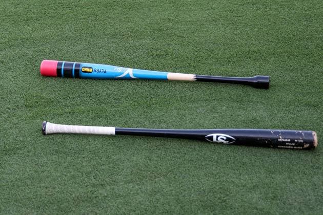 August 15, 2025: Two bats lay on the grass near the batting cage as Chicago White Sox players take batting practice before a game against the Kansas City Royals on Players Weekend at Kauffman Stadium in Kansas City, MO. CSM Kansas City United States of America - ZUMAc04_ 20250815_zma_c04_115 Copyright: xDavidxSmithx