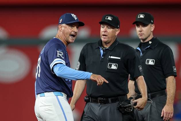 August 15, 2025: Kansas City Royals manager Matt Quatraro (33) argues with home plate umpire Todd Tichenor (13) in front of second base umpire Tom Hanahan during the fifth inning against the Chicago White Sox at Kauffman Stadium in Kansas City, MO. CSM Kansas City United States of America - ZUMAc04_ 20250815_zma_c04_238 Copyright: xDavidxSmithx