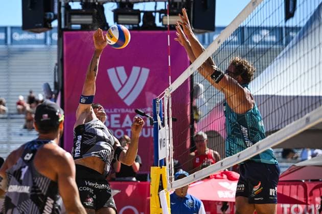 MONTREAL, QC - AUGUST 15: Esteban Grimalt (CHI) bumps the ball near the net during a first round match at Beach Pro Tour Montreal Elite 16 on August 15, 2025 at Parc Jean-Drapeau in Montreal, QC (Photo by David Kirouac Icon Sportswire) VOLLEYBALL: AUG 15 Beach Pro Tour Montreal Elite 16 EDITORIAL USE ONLY Icon250815041