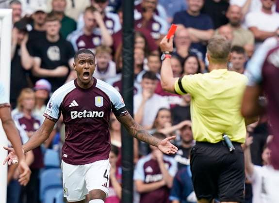 Birmingham, England, 16th August 2025. Ezri Konsa of Aston Villa (L) is shown a red card during the Aston Villa vs Newcastle United Premier League match at Villa Park, Birmingham. Picture credit should read: Andrew Yates Sportimage EDITORIAL USE ONLY. No use with unauthorised audio, video, data, fixture lists, club league logos or live services. Online in-match use limited to 120 images, no video emulation. No use in betting, games or single club league player publications. SPI_025_AY_VILLA_NEWC SPI-4068-0025