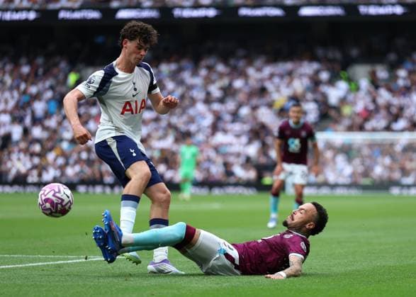16th August 2025; Tottenham Hotspur Stadium, London, England; Premier League Football, Tottenham Hotspur versus Burnley; Hartman of Burnley challenges Archie Gray of Tottenham Hotspur  JohnxPatrickxFletcher