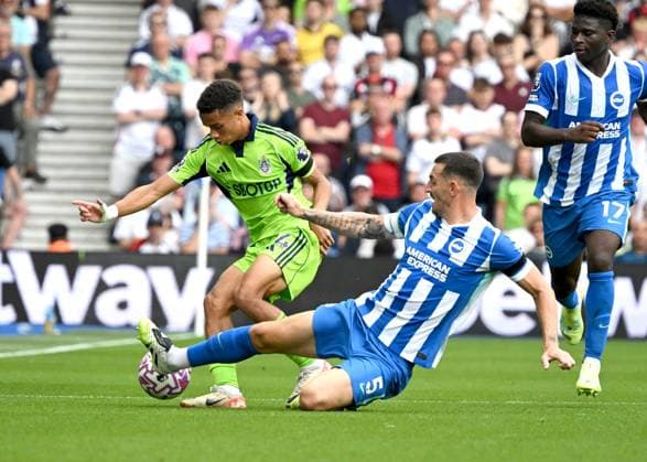 Lewis Dunk of Brighton slides in to rob Josh King of Fulham of the ball during the Premier League match between Brighton and Hove Albion and Fulham at the American Express Stadium, Brighton UK - 16th August 2025 Brighton v Fulham Premier League Football, Amex Stadium, Sussex, United Kingdom - 16 Aug 2025Brighton Amex Stadium Sussex United Kingdom Editorial use only. No merchandising. For Football images FA and Premier League restrictions apply inc. no internet mobile usage without FAPL license - for details contact Football Dataco  Copyright: xLizxFinlayson Shutterstockx 15443909ab