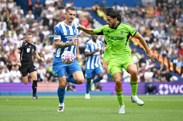 Lewis Dunk of Brighton chases after Raul Jimenez of Fulham during the Premier League match between Brighton and Hove Albion and Fulham at the American Express Stadium, Brighton UK - 16th August 2025 Brighton v Fulham Premier League Football, Amex Stadium, Sussex, United Kingdom - 16 Aug 2025Brighton Amex Stadium Sussex United Kingdom Editorial use only. No merchandising. For Football images FA and Premier League restrictions apply inc. no internet mobile usage without FAPL license - for details contact Football Dataco  Copyright: xLizxFinlayson Shutterstockx 15443909z