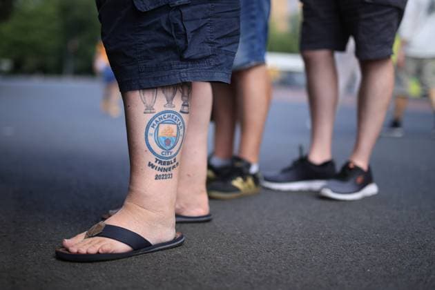 Football - Premier League - Wolverhampton Wanderers v Manchester City 16th August 2025 - Premier League - Wolverhampton Wanderers v Manchester City - A tattoo on the leg of a Manchester City fan depicts the trophies won in the club s treble-winning 2022 23 season - Photo: Simon Stacpoole Offside. Wolverhampton UK Copyright: xSimonxStacpoolexOffside