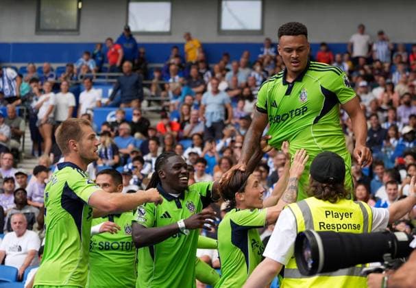 Brighton and Hove Albion v Fulham, Premier League, Football, Amex Stadium, Brighton, UK - 16 Aug 2025 Rodrigo Muniz of Fulham celebrates his late equaliser stood on the LED boards Brighton Amex Stadium Brighton GBR, UK NEWSPAPERS OUT Copyright: xSeanxRyanx