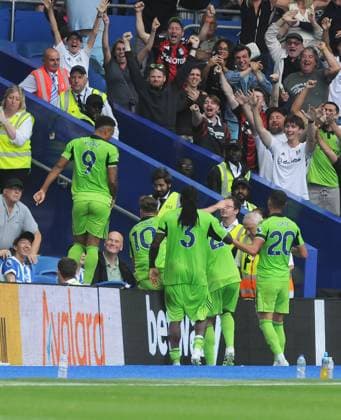 Football - 2025 2026 Premier League - Brighton & Hove Albion vs Fulham - Amex Stadium - Saturday 6th August 2025 Rodrigo Muniz of Fulham jumps onto the hordings after scoring the equalising goal in the last minute of injury time to celebrate with their fans 