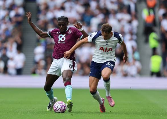 16th August 2025; Tottenham Hotspur Stadium, London, England; Premier League Football, Tottenham Hotspur versus Burnley; Lesley Ugochukwu of Burnley challenged by Micky van de Ven of Tottenham Hotspur  JohnxPatrickxFletcher