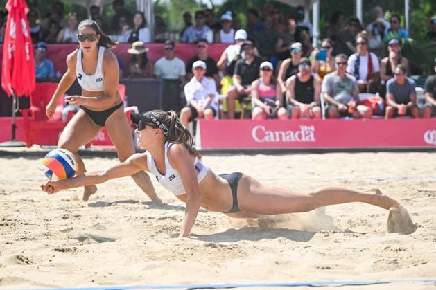 MONTREAL, QC - AUGUST 16: Julia Donlin (USA) plunges to bump the ball during a round of 12 match at Beach Pro Tour Montreal Elite 16 on August 16, 2025 at Parc Jean-Drapeau in Montreal, QC (Photo by David Kirouac Icon Sportswire) VOLLEYBALL: AUG 16 Beach Pro Tour Montreal Elite 16 EDITORIAL USE ONLY Icon250816137