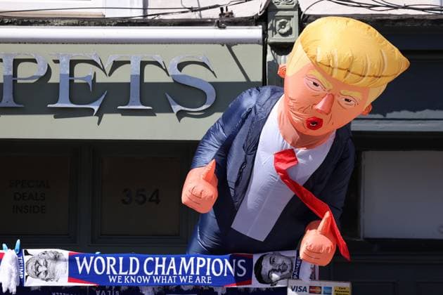 London, England, 17th August 2025. An inflatable of President Donald Trump next to a World Champions scarf ahead of the Chelsea vs Crystal Palace Premier League match at Stamford Bridge, London. Picture credit should read: Paul Terry Sportimage EDITORIAL USE ONLY. No use with unauthorised audio, video, data, fixture lists, club league logos or live services. Online in-match use limited to 120 images, no video emulation. No use in betting, games or single club league player publications. SPI_005_PT_Chelsea_Crystal_Palacex SPI-4073-0007
