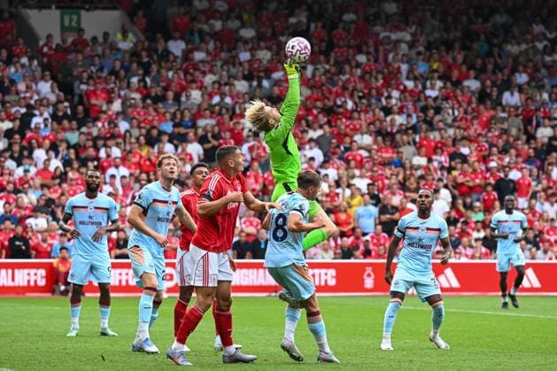 Nottingham, England, 17th August 2025. Caoimhin Kelleher of Brentford claims the cross during the Nottingham Forest vs Brentford Premier League match at the City Ground, Nottingham. Picture credit should read: Craig Thomas Sportimage EDITORIAL USE ONLY. No use with unauthorised audio, video, data, fixture lists, club league logos or live services. Online in-match use limited to 120 images, no video emulation. No use in betting, games or single club league player publications. SPI_090_CT_Nottingham_Forest_v_Brentford SPI-4071-0090