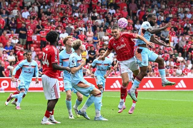 Nottingham, England, 17th August 2025. Nikola Milenkovic of Nottingham Forest wins the header during the Nottingham Forest vs Brentford Premier League match at the City Ground, Nottingham. Picture credit should read: Craig Thomas Sportimage EDITORIAL USE ONLY. No use with unauthorised audio, video, data, fixture lists, club league logos or live services. Online in-match use limited to 120 images, no video emulation. No use in betting, games or single club league player publications. SPI_115_CT_Nottingham_Forest_v_Brentford SPI-4071-0115