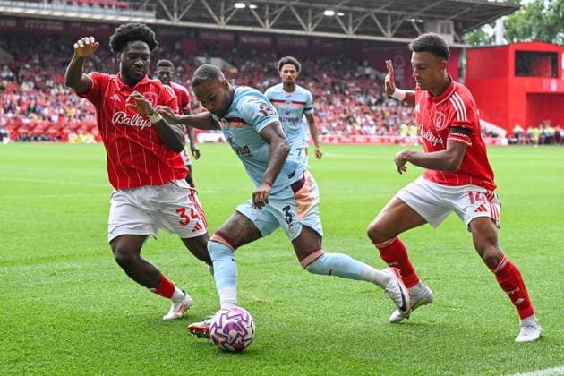 Nottingham, England, 17th August 2025. Rico Henry of Brentford holds off Ola Aina of Nottingham Forest during the Nottingham Forest vs Brentford Premier League match at the City Ground, Nottingham. Picture credit should read: Craig Thomas Sportimage EDITORIAL USE ONLY. No use with unauthorised audio, video, data, fixture lists, club league logos or live services. Online in-match use limited to 120 images, no video emulation. No use in betting, games or single club league player publications. SPI_117_CT_Nottingham_Forest_v_Brentford SPI-4071-0117