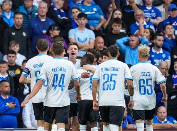 Jorne Spileers of Club Brugge celebrates with team mates after scoring to give Brugge a 0-2 lead. Rangers v Club Brugge, UEFA Champions League, Play-Off Round, First Leg, Football, Ibrox Stadium, Glasgow, Scotland, UK - 19 Aug 2025Glasgow Ibrox Stadium Scotland United Kingdom EDITORIAL USE ONLY No use with unauthorised audio, video, data, fixture lists, club league logos or live services. Online in-match use limited to 120 images, no video emulation. No use in betting, games or single club league player publications. Copyright: xStuartxWallace Shutterstockx 15446679t