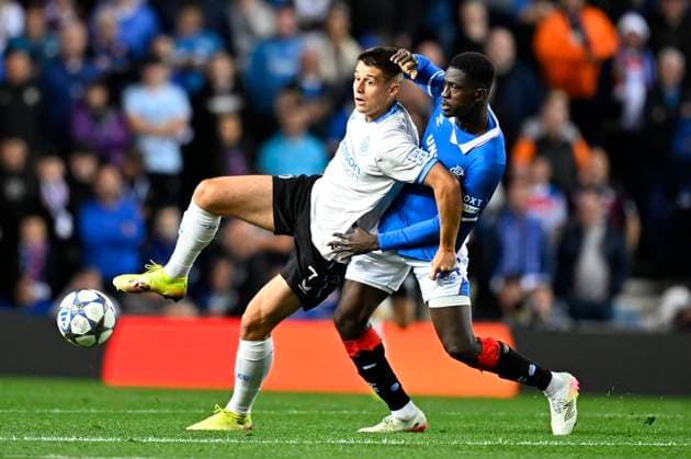 Rangers FC v Club Brugge - UEFA Champions League GLASGOW, SCOTLAND - AUGUST 19 : Tresoldi Nicolo forward of Club Brugge and Djiga Nasser defender of Rangers FC during the UEFA Champions League 2025 26 play-off round first leg between Rangers FC and Club Brugge on August 19, 2025 in Glasgow, Scotland, 19 08 2025 Glasgow Scotland  Copyright: xTomasxSiskx