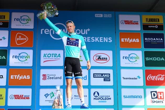 Belgian Tim Merlier of Soudal Quick-Step celebrates on the podium in the leader s jersey after winning the first stage of the Renewi Tour multi-stage cycling race, from Terneuzen to Breskens, The Netherlands (182,7 km) on Wednesday 20 August 2025. The five-day race takes place in Belgium and the Netherlands. DAVIDxPINTENS  x131652798x