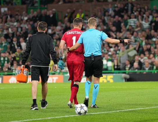 Injured Kairat Almaty goalkeeper Alexandr Zarutskiy limps off the pitch after rejecting a stretcher. Celtic v Kairat Almaty, UEFA Champions League, Play-Off Round, First Leg, Football, Celtic Park, Glasgow, Scotland, UK - 20 Aug 2025Glasgow Celtic Park Scotland United Kingdom EDITORIAL USE ONLY No use with unauthorised audio, video, data, fixture lists, club league logos or live services. Online in-match use limited to 120 images, no video emulation. No use in betting, games or single club league player publications. Copyright: xStuartxWallace Shutterstockx 15446684ay