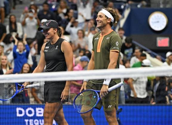 Iga Swiatek and Casper Ruud react after defeating Jessica Pegula and Jack Draper during the Mixed Doubles Semi Finals on Arthur Ashe Stadium at the 2025 US Open Tennis Championship at the USTA Billie Jean King National Tennis Center in New York City on Wednesday, August 20, 2025 in New York City. Jessica Pegula and Jack Draper were defeated by Iga Swiatek and Casper Ruud 5-3-3-5 8-10 and advance to the finals.  NYP20250820501 LarryxMarano