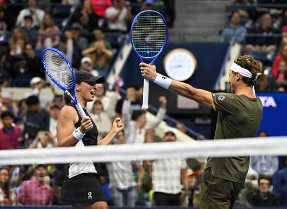 Iga Swiatek and Casper Ruud react after defeating Jessica Pegula and Jack Draper during the Mixed Doubles Semi Finals on Arthur Ashe Stadium at the 2025 US Open Tennis Championship at the USTA Billie Jean King National Tennis Center in New York City on Wednesday, August 20, 2025 in New York City. Jessica Pegula and Jack Draper were defeated by Iga Swiatek and Casper Ruud 5-3-3-5 8-10 and advance to the finals.  NYP20250820503 LarryxMarano