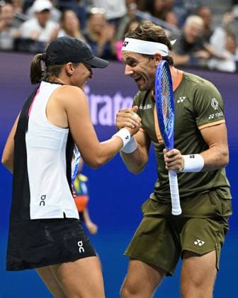 Iga Swiatek and Casper Ruud react during the Mixed Doubles Final against Sara Errani and Andrea Vavassori on Arthur Ashe Stadium at the 2025 US Open Tennis Championship at the USTA Billie Jean King National Tennis Center in New York City on Wednesday, August 20, 2025 in New York City.  NYP20250820528 LarryxMarano