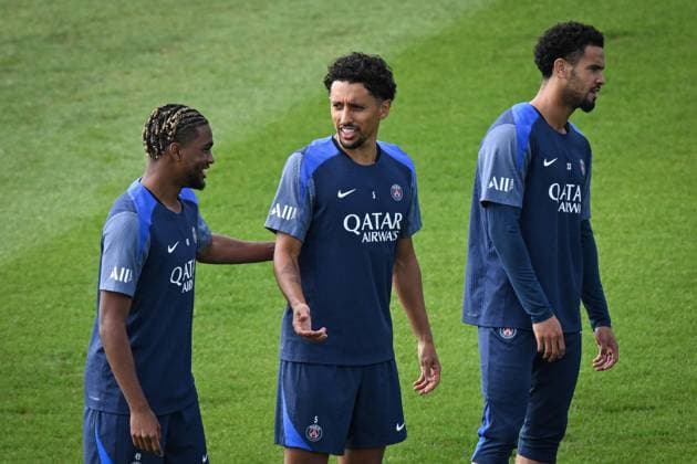Ligue 1 PSG training before facing ANGERS SCO - FA Paris Saint-Germain’s defender Marquinhos looks on next to Paris Saint-Germain’s forward Ibrahim Mbaye during a training session at the PSG Campus on August 21, 2025, before the French L1 football match between Paris Saint-Germain and Angers SCO at the Parc des Princes stadium in Paris on August 22, 2025. Photo by Firas Abdullah ABACAPRESS.COM Paris Île-de-France France  Copyright: xAbdullahxFiras ABACAx