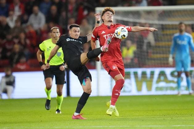 Adrian Sut of FCSB challenges Dante Polvara of Aberdeen for the ball Aberdeen v FCSB, UEFA Europa League, Play-Off Round, First Leg, Football, Pittodrie, Aberdeen, Scotland, UK - 21 Aug 2025Aberdeen Pittodrie Scotland United Kingdom EDITORIAL USE ONLY No use with unauthorised audio, video, data, fixture lists, club league logos or live services. Online in-match use limited to 120 images, no video emulation. No use in betting, games or single club league player publications. Copyright: xPetexSummers Shutterstockx 15449391ez