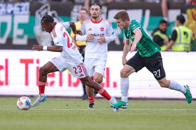 22.08.2025, Fußball, Preußen Münster - 1. FC Nürnberg, 2. Fußball Bundesliga, Preußenstadion, Saison 2025 2026: Mohamed AlÃ¬ Zoma (1FC Nuernberg 23) im Zweikampf gegen Jano ter Horst (Preussen Muenster 27) DFB regulations prohibit any use of photographs as image sequences and or quasi-video. Nordrhein-Westfalen Deutschland