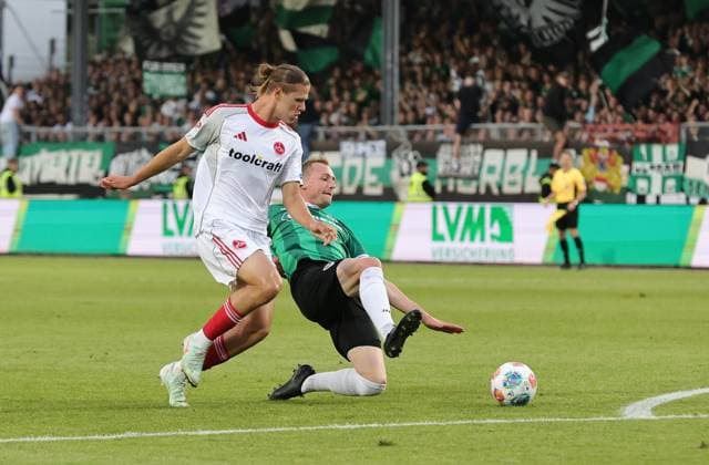 22.08.2025 - Fussball - Saison 2025 2026 - 2. Fussball - Bundesliga - 03. Spieltag: SC Preußen Münster SCP - 1. FC Nürnberg FCN ( Club ) - Sportfoto Zink DaMa - xdaxmax - DFL regulations prohibit any use of photographs as image sequences and or quasi-video - only for editorial use - Artem Stepanov (11, 1. FC Nürnberg FCN ) Simon Scherder (15, Preußen Münster )