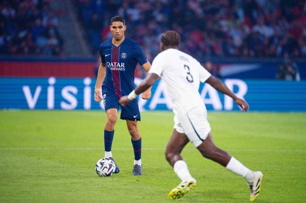 FOOTBALL : PSG vs Angers - Ligue1 - 22 08 2025 Achraf Hakimi ( 2 - PSG ) and Jacques Ekomie ( 3 - Angers ) during the Ligue 1 match between Paris Saint Germain and Angers SCO at Parc Des Princes on August 22 , 2025 in Paris, France. ( Photo by Federico Pestellini PsnewZ ) - ParisFrance  Copyright: xx