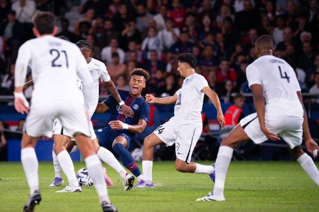 FOOTBALL : PSG vs Angers - Ligue1 - 22 08 2025 Desire Doue ( 14 - PSG ) and Lilian RAOLISOA ( 27 - Angers ) during the Ligue 1 match between Paris Saint Germain and Angers SCO at Parc Des Princes on August 22 , 2025 in Paris, France. ( Photo by Federico Pestellini PsnewZ ) - ParisFrance  Copyright: xx