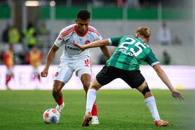 MUNSTER, GERMANY - 22 AUGUST, 2025: Henri Koudossou, Luca Bolay, The football match of 2.Bundesliga SC Preussen Munster 1. FC Nurnberg at LVM-Preussenstadion  Copyright: xVITALIIxKLIUIEVx