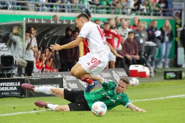 22.08.2025, xgrfx, Fussball 2.Bundesliga, Preußen Münster - 1.FC Nürnberg v.l. Julian Justvan (1.FC Nürnberg), Paul Jaeckel (Preußen Münster) (DFL DFB REGULATIONS PROHIBIT ANY USE OF PHOTOGRAPHS as IMAGE SEQUENCES and or QUASI-VIDEO) Münster