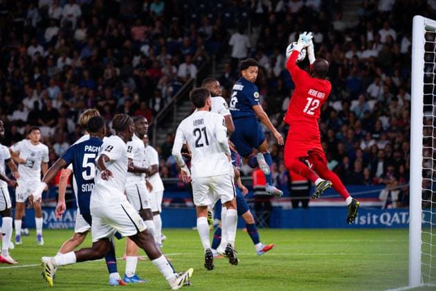 FOOTBALL : PSG vs Angers - Ligue1 - 22 08 2025 Herve Koffi ( 12 - Angers ) a@Marquinhos ( 5 - PSG ) during the Ligue 1 match between Paris Saint Germain and Angers SCO at Parc Des Princes on August 22 , 2025 in Paris, France. ( Photo by Federico Pestellini PsnewZ ) - ParisFrance  Copyright: xx