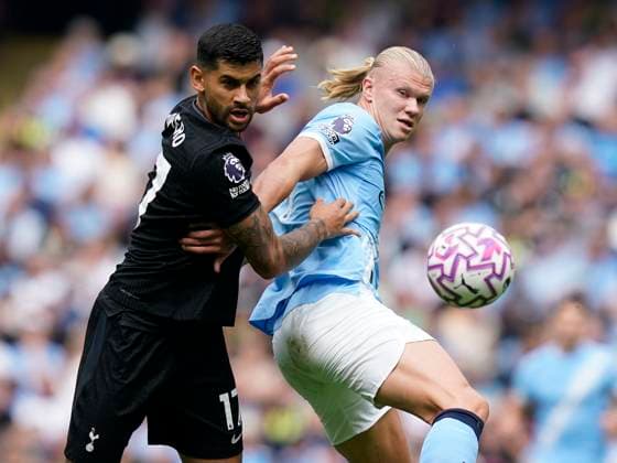 Manchester, England, 23rd August 2025. Erling Haaland of Manchester City (R) is challenged by Cristian Romero of Tottenham during the Manchester City vs Tottenham Hotspur Premier League match at the Etihad Stadium, Manchester. Picture credit should read: Andrew Yates Sportimage EDITORIAL USE ONLY. No use with unauthorised audio, video, data, fixture lists, club league logos or live services. Online in-match use limited to 120 images, no video emulation. No use in betting, games or single club league player publications. SPI_002_AY_MAN_CITY_SPURS SPI-4081-0002