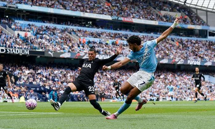 Manchester, England, 23rd August 2025. Omar Marmoush of Manchester City (R) shoots wide during the Manchester City vs Tottenham Hotspur Premier League match at the Etihad Stadium, Manchester. Picture credit should read: Andrew Yates Sportimage EDITORIAL USE ONLY. No use with unauthorised audio, video, data, fixture lists, club league logos or live services. Online in-match use limited to 120 images, no video emulation. No use in betting, games or single club league player publications. SPI_017_AY_MAN_CITY_SPURS SPI-4081-0017
