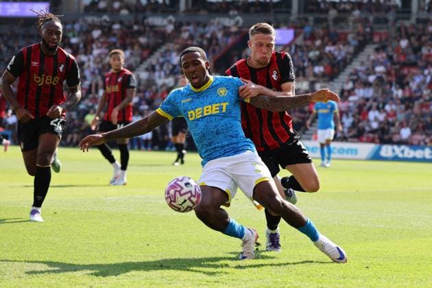 Football - 2025 2026 Premier League - AFC Bournemouth vs Wolverhampton Wanderers - The Vitality Stadium - Saturday 23rd August 2025 Adrien Truffert of Bournemouth holds off Jackson Tchatchoua of Wolverhampton during the Premier League match at the Vitality Stadium COLORSPORT Shaun Boggust 