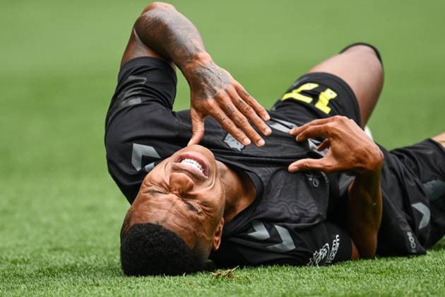 Burnley, England, 23rd August 2025. Reinildo Mandava in pain after a challenge during the Burnley vs Sunderland Premier League match at Turf Moor, Burnley. Picture credit should read: Craig Thomas Sportimage EDITORIAL USE ONLY. No use with unauthorised audio, video, data, fixture lists, club league logos or live services. Online in-match use limited to 120 images, no video emulation. No use in betting, games or single club league player publications. SPI_035_CT_Burnley_v_Sunderland SPI-4083-0035