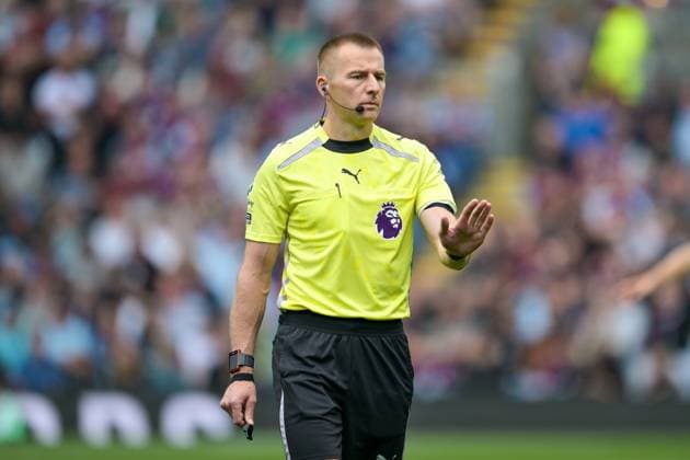 23rd August 2025; Turf Moor, Burnley, Lancashire, England; Premier League Football, Burnley versus Sunderland; Match referee Michael Salisbury gives instructions to the players  LeexDurkin